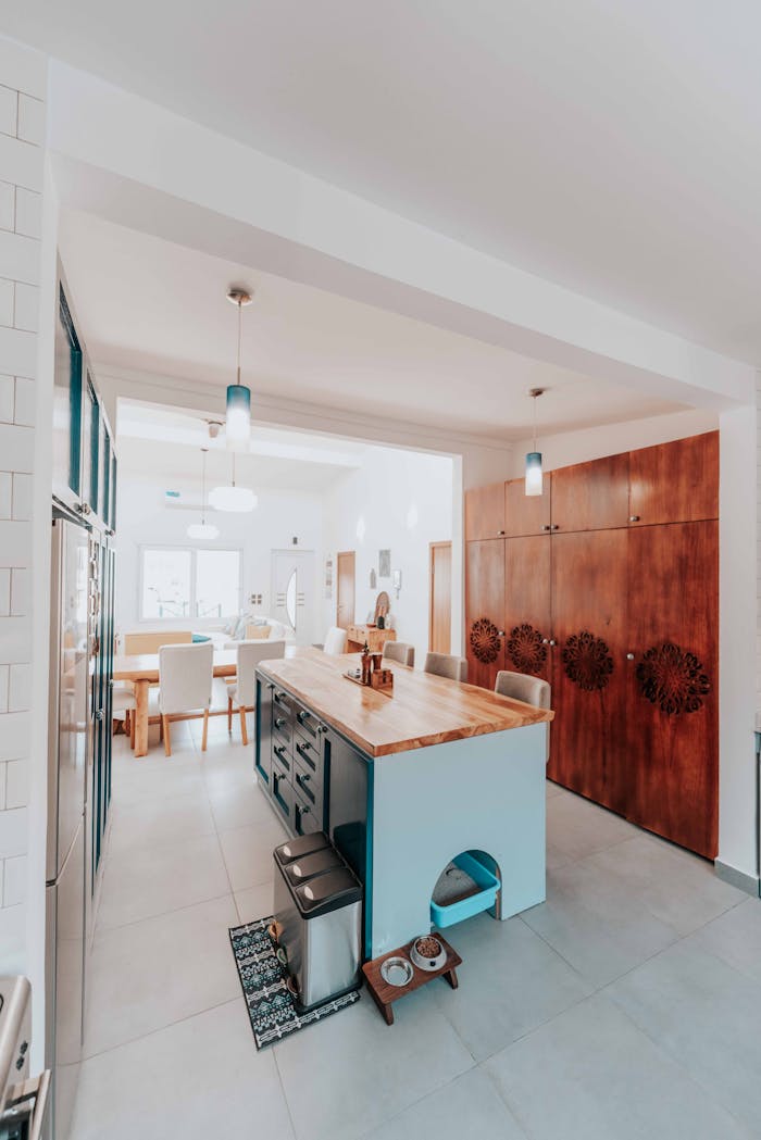 gallery-1 Sleek kitchen interior with island, Scandinavian design, and bright lighting.